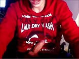 A boy in red sweatshirt masturbates
