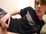 A charming boy masturbates in his shorts