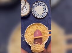 Adding his special sauce to the pasta