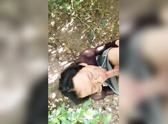 Asian in mesh top enjoying outdoors