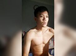 Asian muscle boy wanks and cums with load moans
