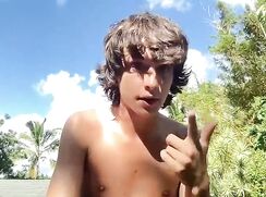 Beautiful naked lad putting on a web-cam show on a roof