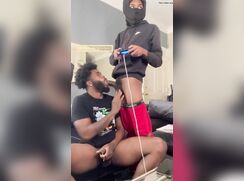 Black guy wanks and sucks a gamer while he is playing