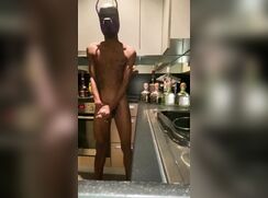 Black pup wanks in the kitchen