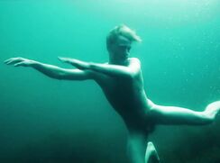 Blond dude swimming nake