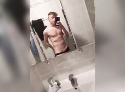 blonde boy jerks off in bathroom