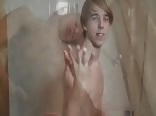 Blonde boy taking a bath