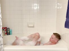 Blonde twink has a bubble bath and a wank
