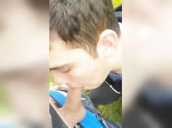 Boy blows his friend outdoors and swallows his cum