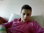 Boy porn in pink shirt yanks on his big cock 