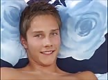 Boy posing and masturbate on a bed
