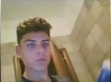 Boy with nice eyes goes to the bathroom for privacy 