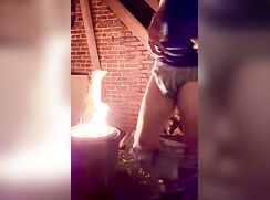 Bro strips at fire pit showing off his bikini briefs