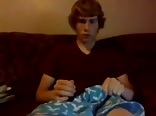 Cam boy stroking his meat on the sofa