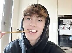 Curly blue-eyed teenager sucks cock