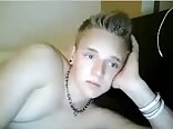 Cute blond boy lays in bed jerking and checking out gay porn