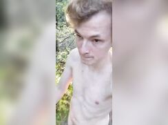 Cute exhibitionist walks around the forest