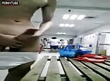 Dude takes care of bulge in his briefs with others around 
