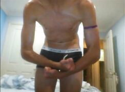 Faceless oiled boy in underwear