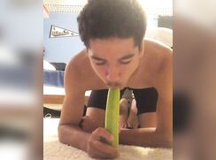 Horny Black Teen sucking a cucumber