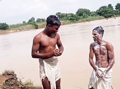 Indians Lads wash in river (nn)