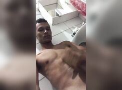 Latino wanks and cums big in the bathroom