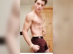 Muscular twink showing off his body