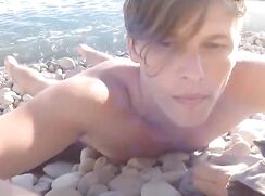 nudist on a peble beach
