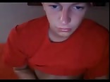 Orange shirt boy porn wanks on orange couch