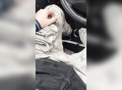 Pissing on his friend in the car