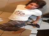 Sasha on the floor of a restaurant bathroom pissing himself