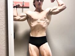 sexy bodybuilder showing off legs