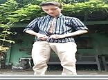 Sexy boy dancing striptease in the backyard