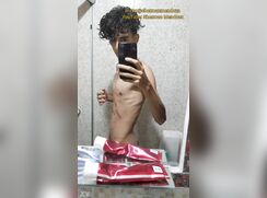 Shaking his cock to the rhythm of the music.