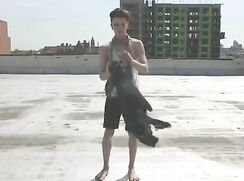 Short film of three boys stripping on a NY rooftop
