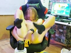 Shy gamer player with dildo