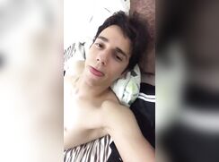 Smiling boy wanks off camera