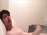 Standing on his bed