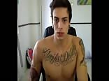 Tattooed young jock jerks on Skype