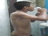the cute boy washes himself