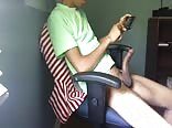 Twink checking out porn on his phone 