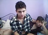 two boys play on the bed