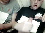 Two friends masturbate in the sofa