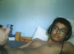 Webcam black boy with glasses wanks and cums